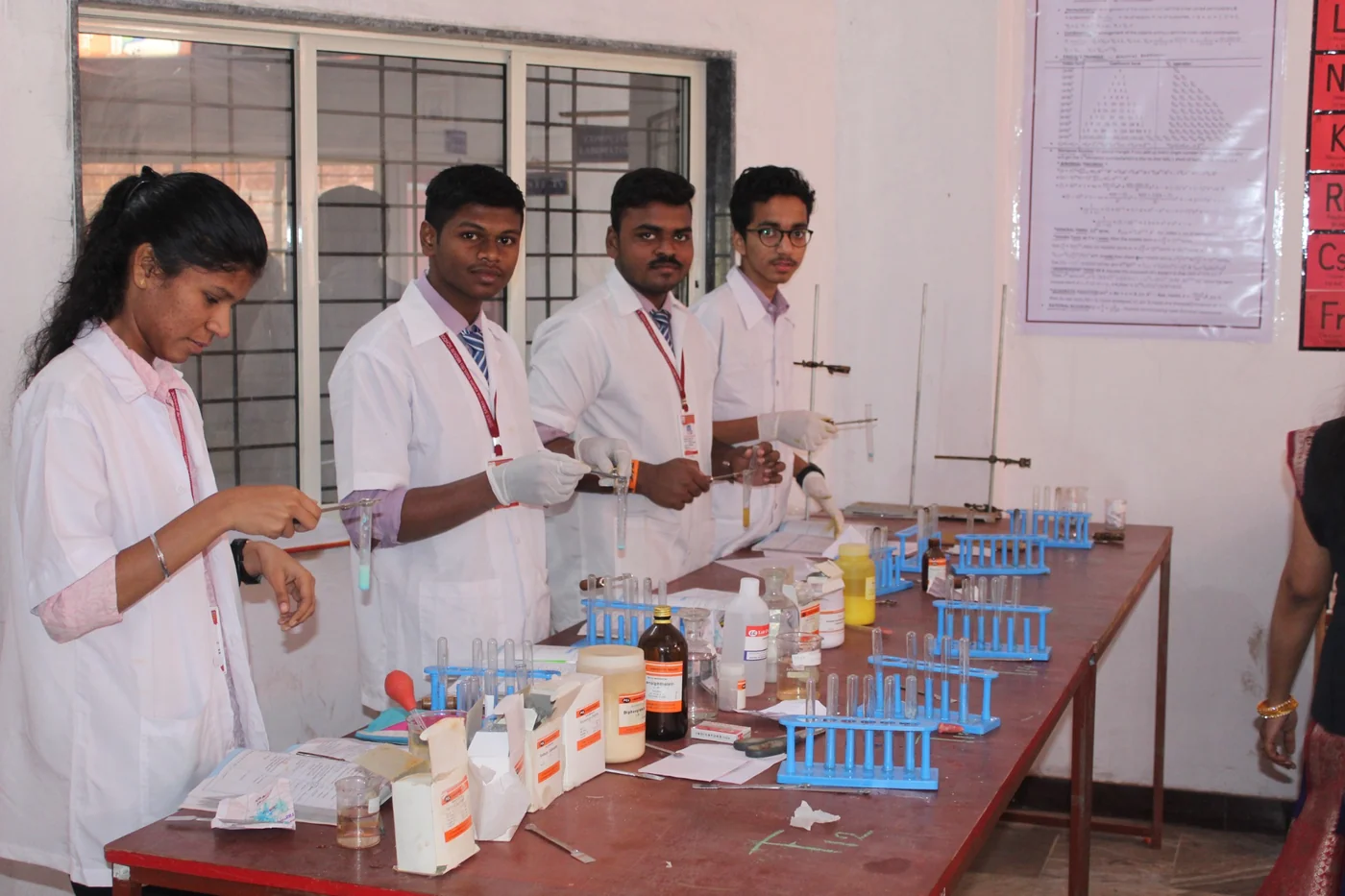 SSKEMS students conducting another science practical in a laboratory.